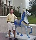 Wally with Carousel horse at the Radisson Convention Ctr., now the Sherator